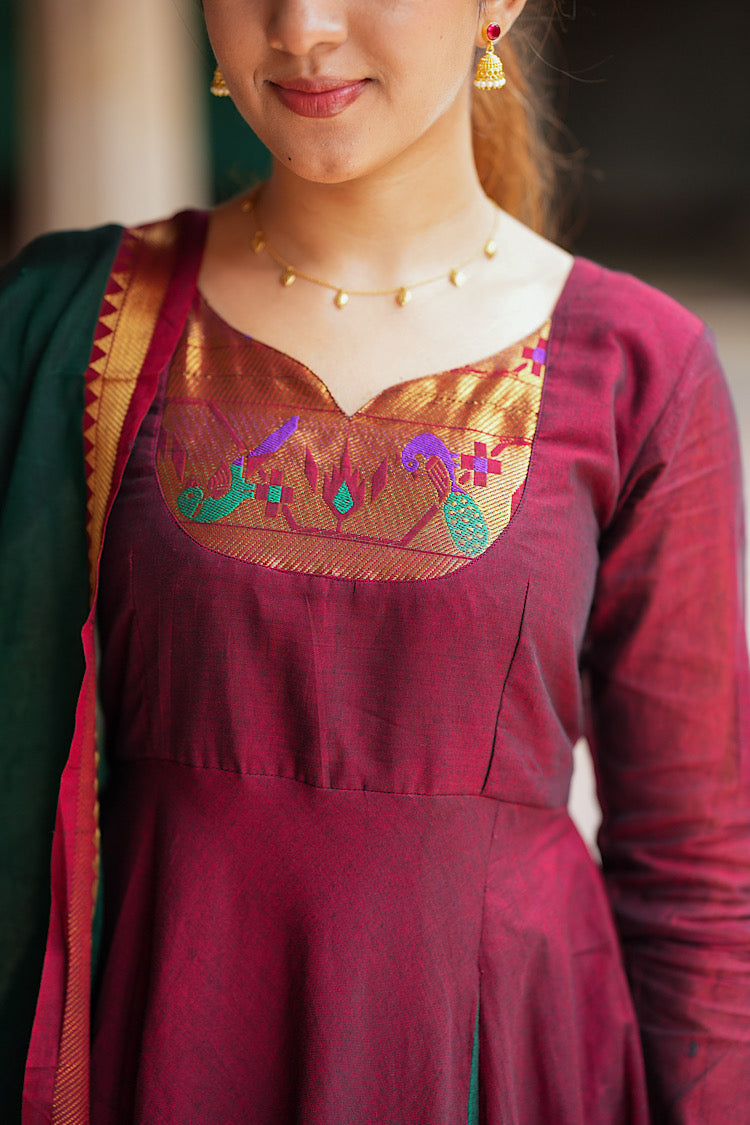 Close-up of the intricate Paithani border neckline on the maroon cotton anarkali.