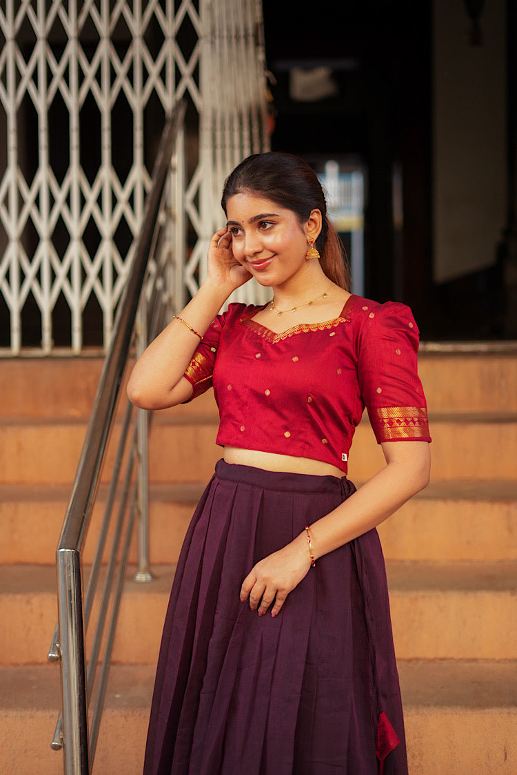 Close-up of the red crop top with puff sleeves and sweetheart neckline