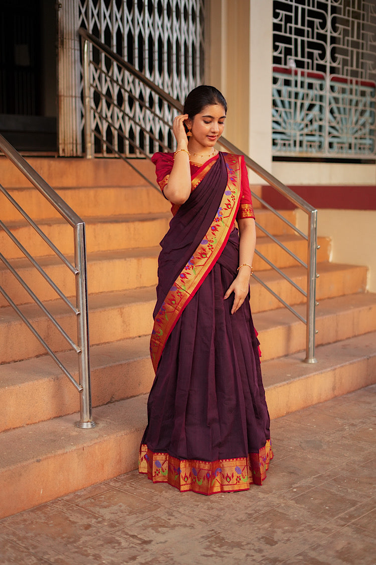 Elegant drape of the maroon pleated skirt and red crop top set