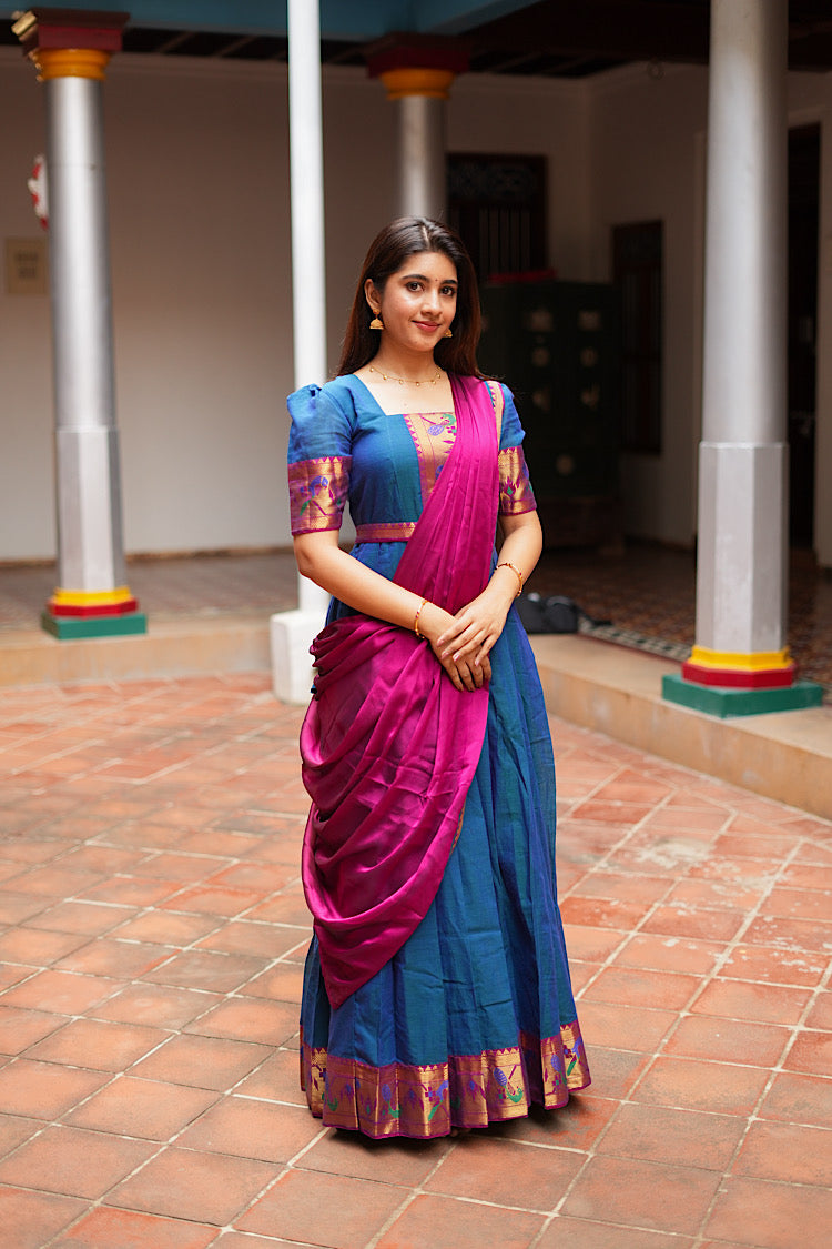 Full-length view of the peacock blue pleated gown with a magenta dupatta draped elegantly.
