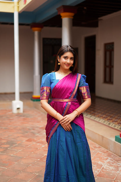 Peacock blue ethnic maxi dress styled as a half-saree with a magenta silk georgette dupatta.