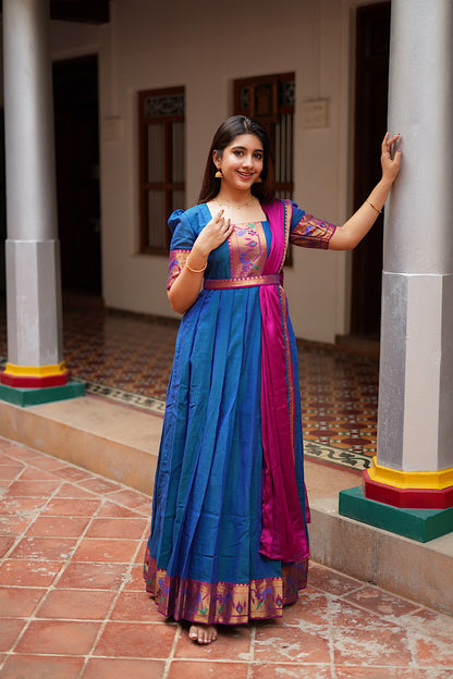 Peacock blue pleated ethnic maxi dress with dupatta draped over the shoulder and a gold zari belt.