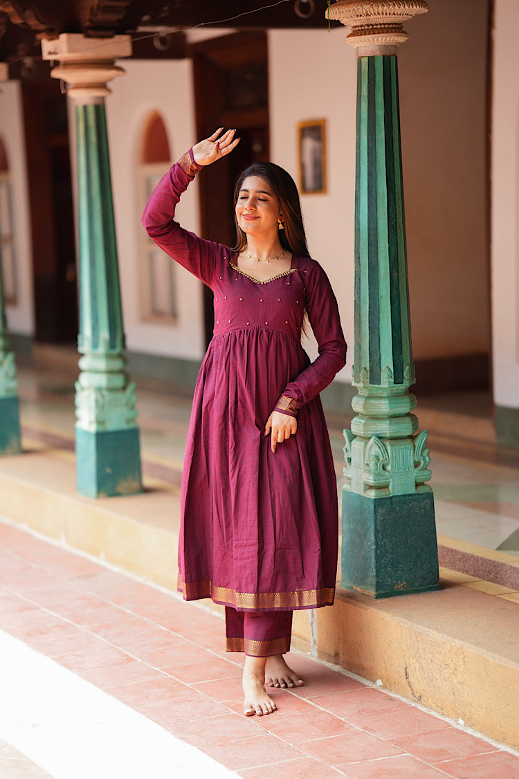 Full-length view of the maroon mangalgiri cotton anarkali suit showing the gathered flare and zari hemline