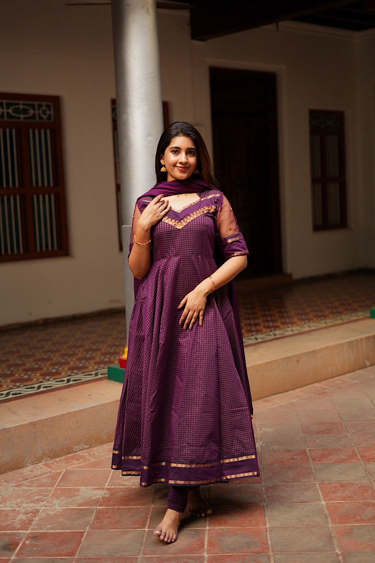 Front view of the Aarya vine purple anarkali suit with dupatta draped over the shoulder.