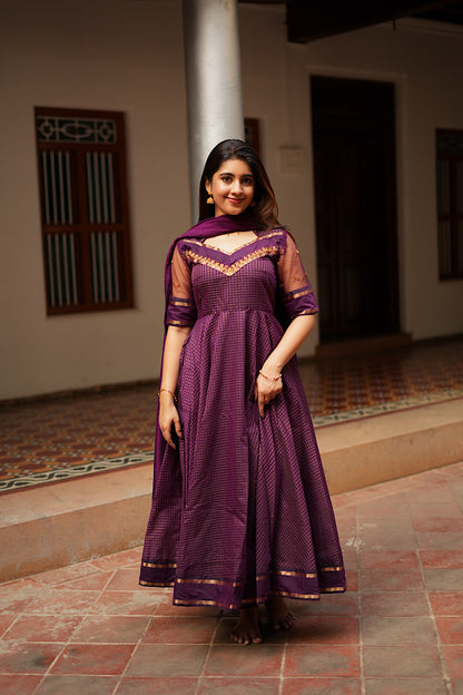 Full-length view of the purple anarkali suit set with a matching solid dupatta.