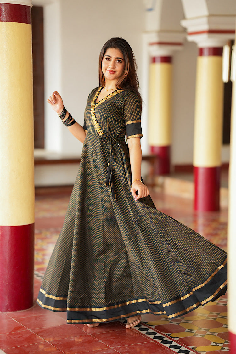 Full-length view of the flared black silk multiway dress spinning to show volume