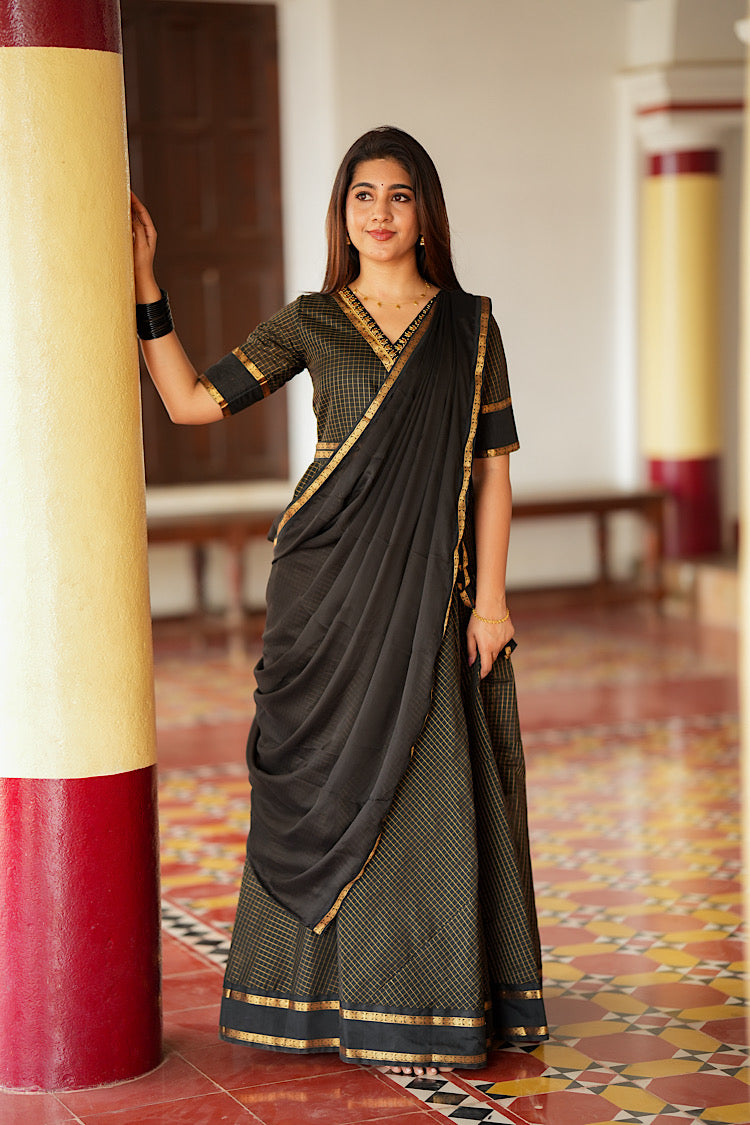 Black silk multiway dress styled with a draped dupatta like a saree pallu