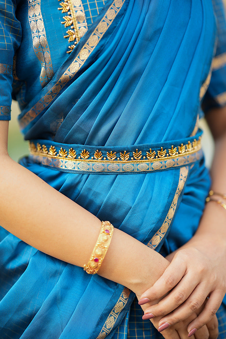 Close-up of the matching Aari embroidered fabric belt on the waist