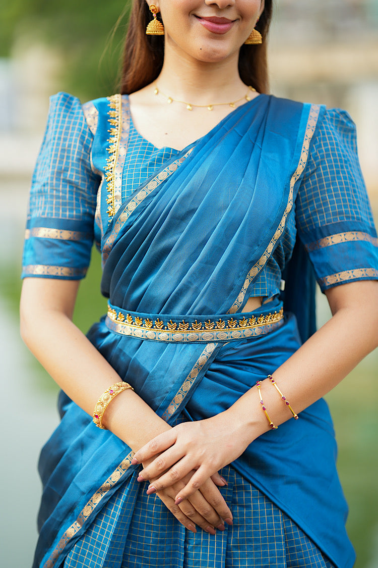 Front close-up of the pleated dupatta draped over the peacock blue crop top