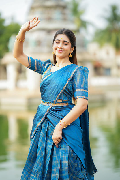 Full-length view of the versatile peacock blue half saree set by Pleated Up