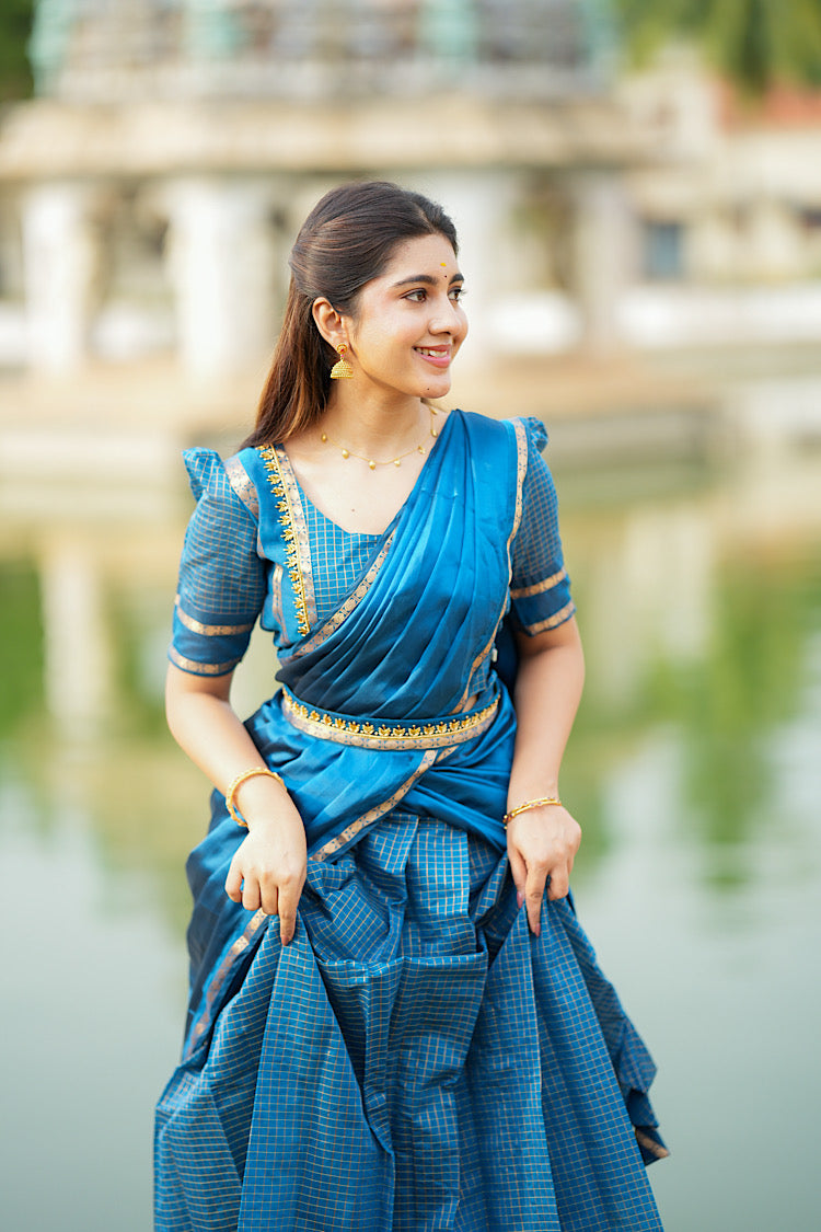 Close-up of the retta petta border on the peacock blue silk skirt