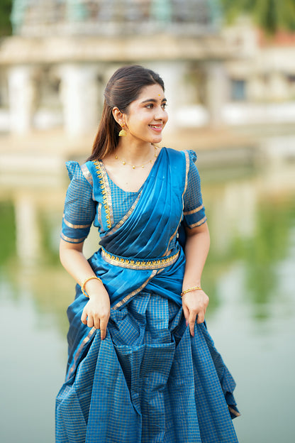 Close-up of the retta petta border on the peacock blue silk skirt