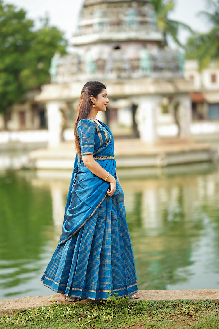 Side profile of the peacock blue Aarani silk skirt and crop top set