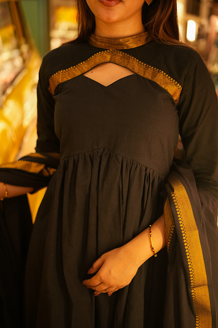 Close-up of the gathered bust and keyhole neckline of the black Mangalgiri cotton anarkali.