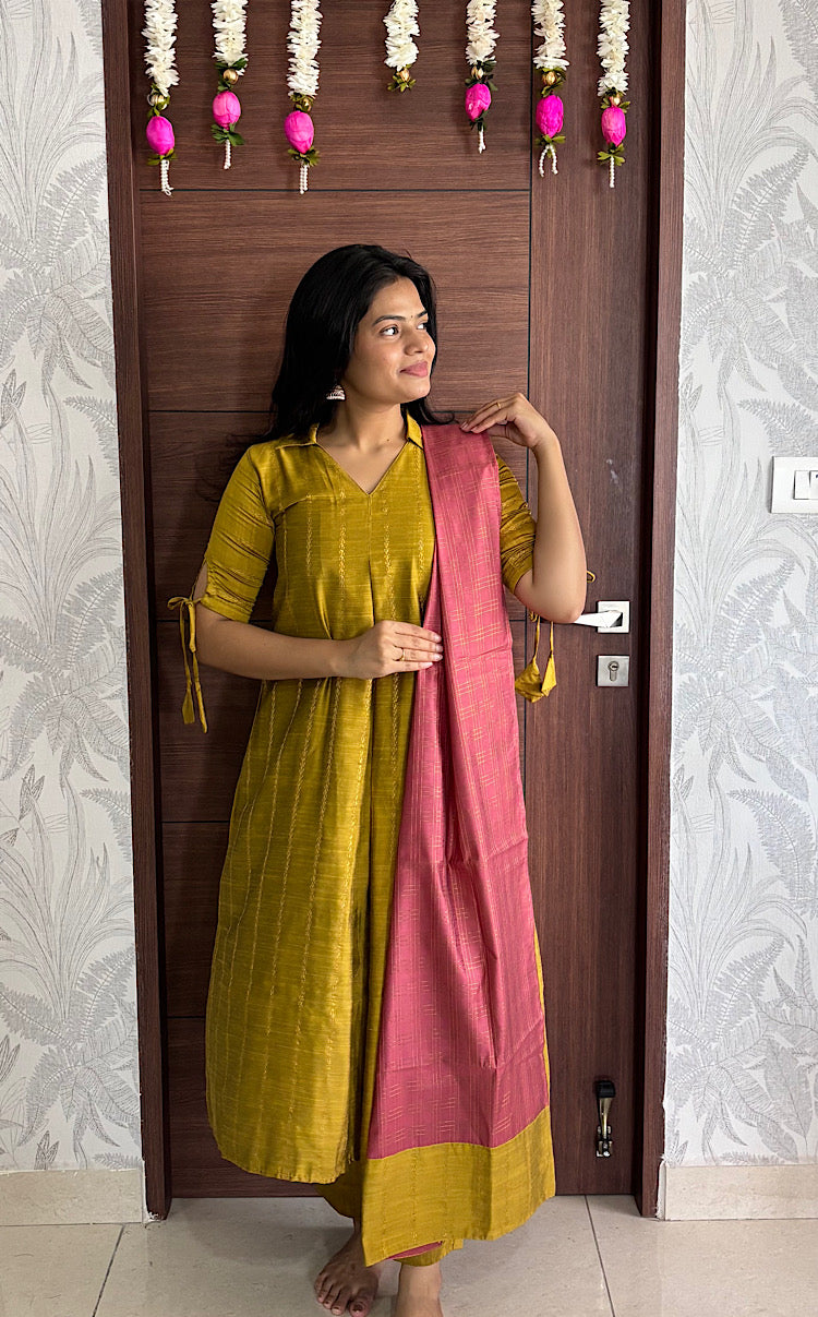Mustard yellow textured kurta paired with contrast mauve pink dupatta and straight pants
