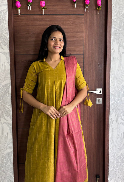 Front view of festive mustard kurta set with dupatta showing center pleat detail