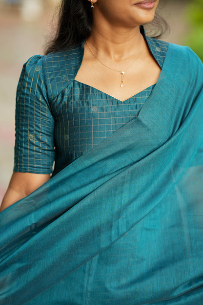 Close-up of Queen Anne neckline and gold zari check detailing
