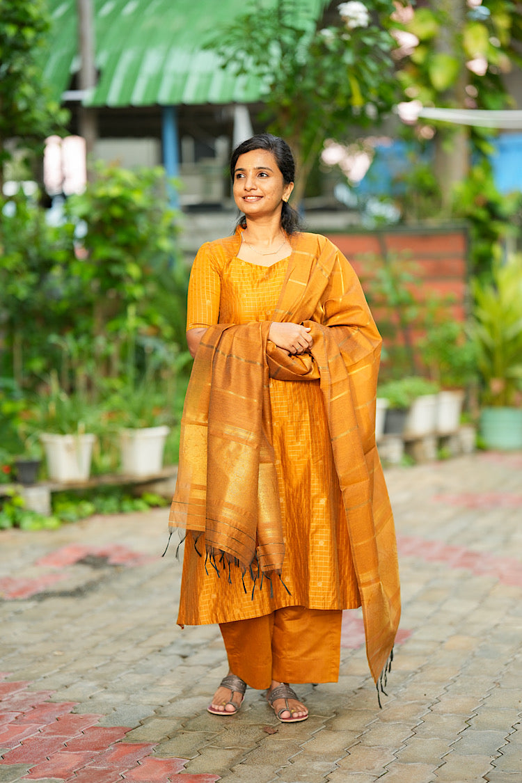 Flared mustard yellow raw silk kurta set with draped woven zari border dupatta