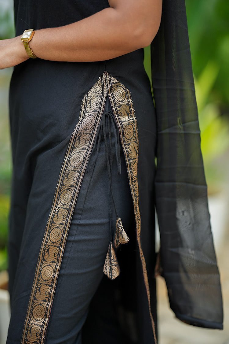 Close-up of side slit and ties on black A-line kurta