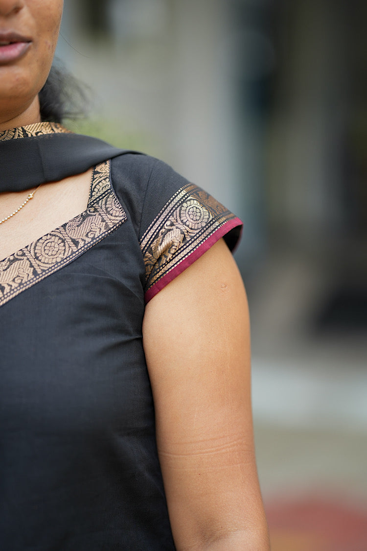 Cap sleeve detail with gold zari and maroon piping