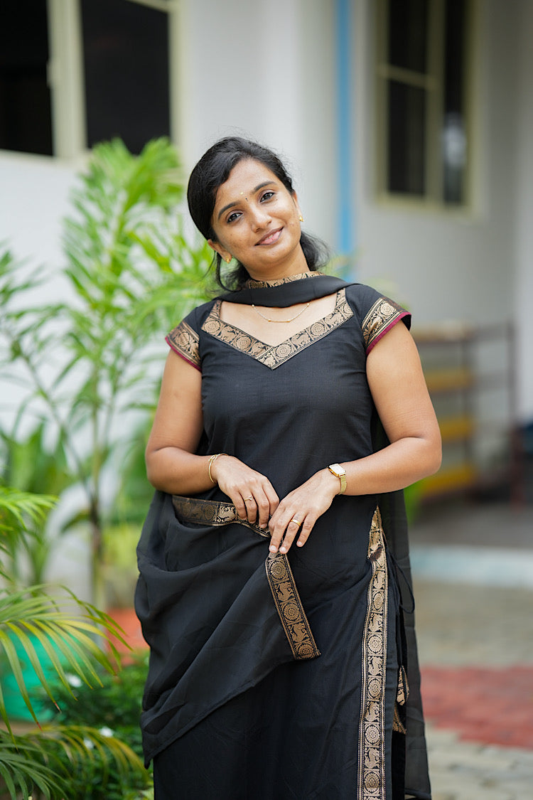 Full length view of black kurti set with dupatta draped