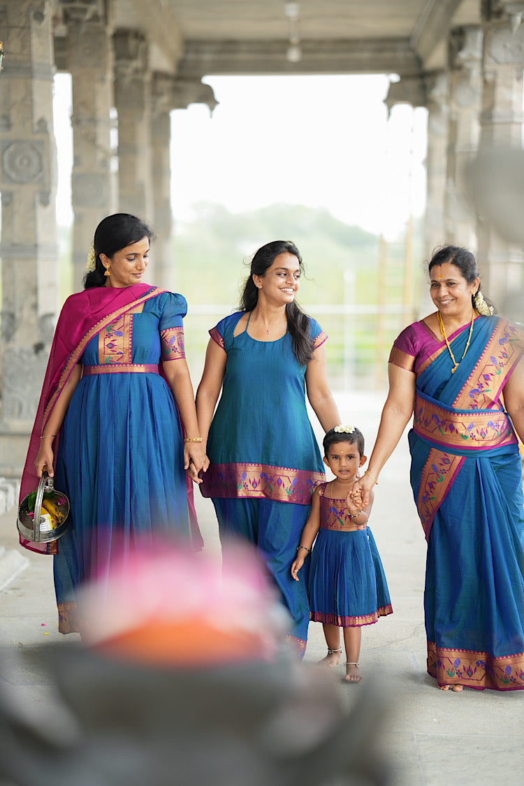 Wide leg peacock blue palazzo pants with traditional woven paithani border at the hem