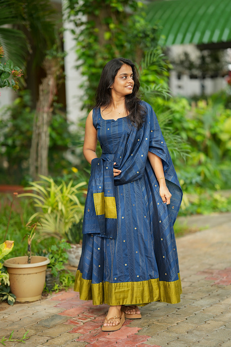 Sleeveless blue green anarkali set with drape featuring woven gold zari buttis