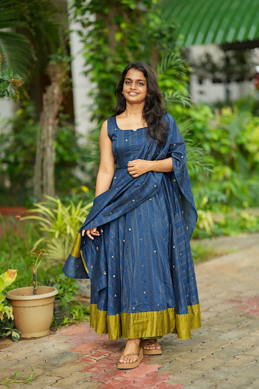 Blue green raw silk anarkali suit with woven zari stripes and contrast olive border