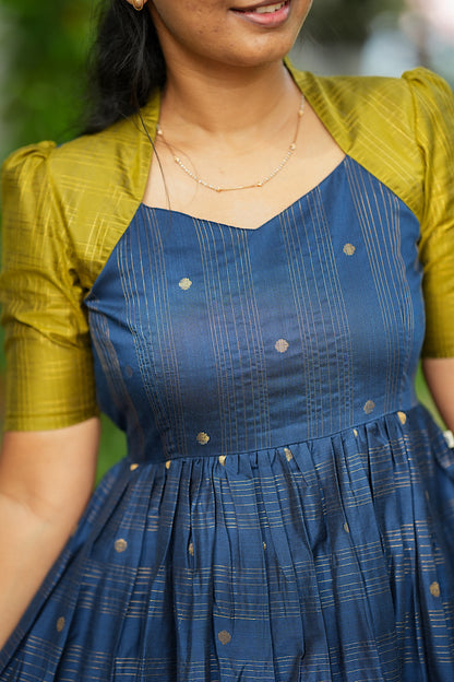 Close up of Queen Anne neckline and woven zari checks on raw silk midi dress