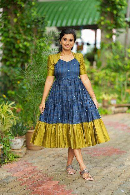 Front full view of blue and olive green raw silk midi dress with tiered flare