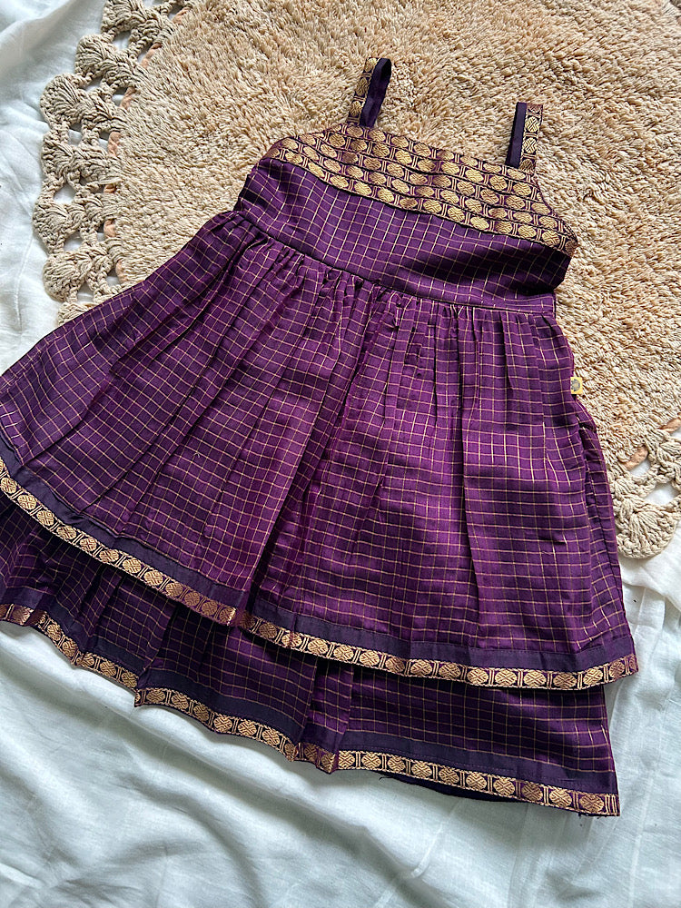 Front view of wine ethnic frock for girls showing pleated skirt and woven yoke