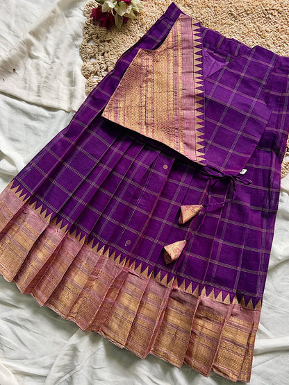 Flatlay view of violet checked chettinad cotton pavadai sattai set with side ties and tassels