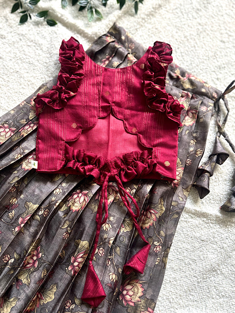 Back view of maroon crop top showing scalloped cutout and tie-up string detail