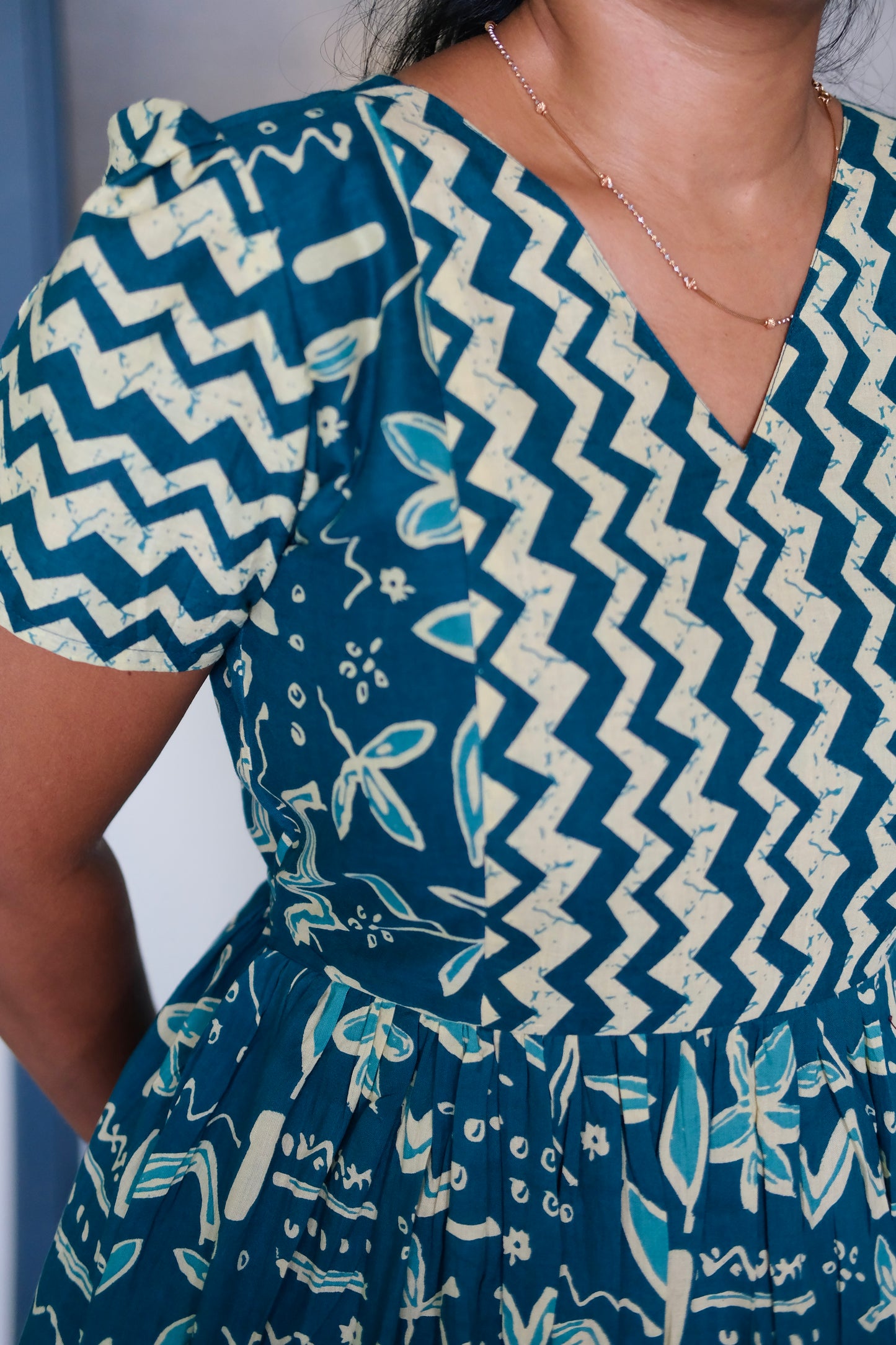 Close-up of the V-neckline and chevron print on the feeding nighty cotton fabric