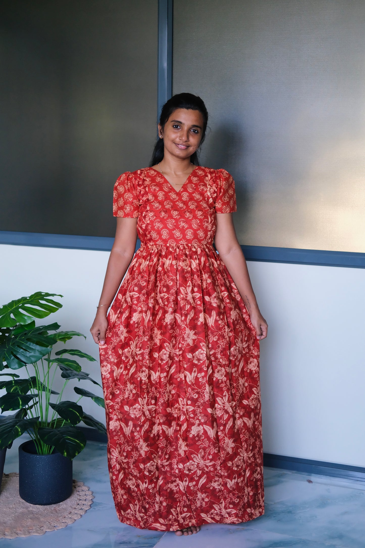 Full-length view of the red cotton maxi nighty showing its relaxed fit and flowing drape.
