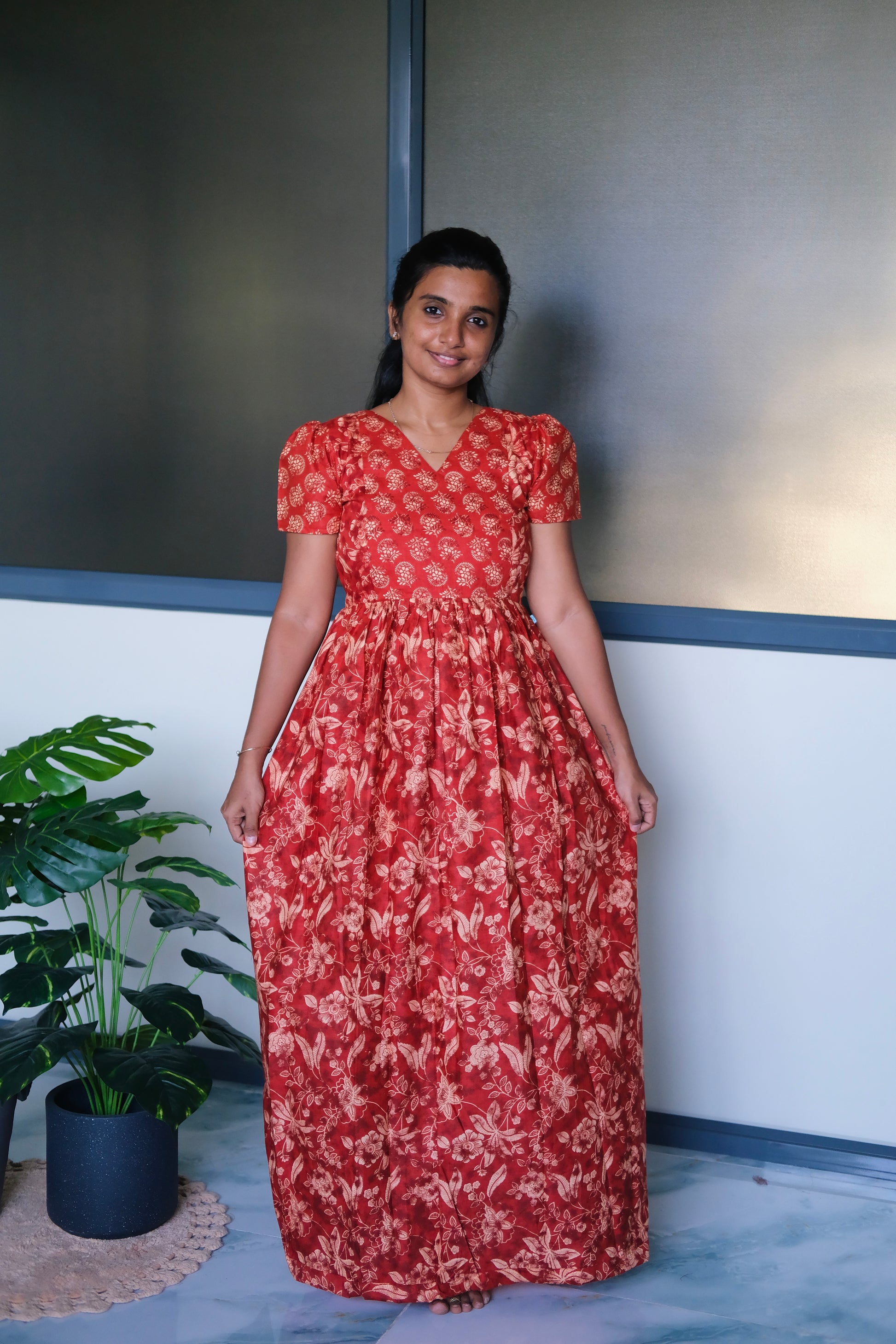 Full-length view of the red cotton maxi nighty showing its relaxed fit and flowing drape.