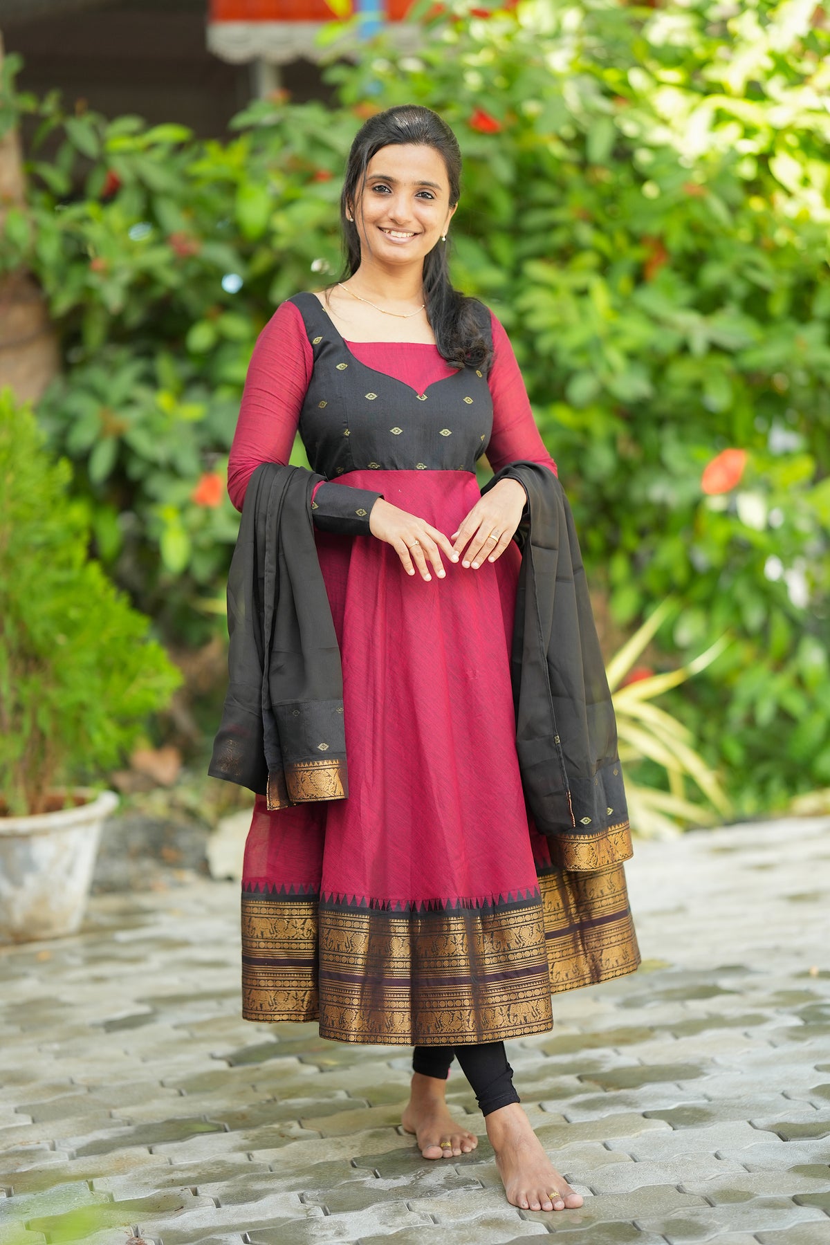 Front view of red and black cotton anarkali suit set