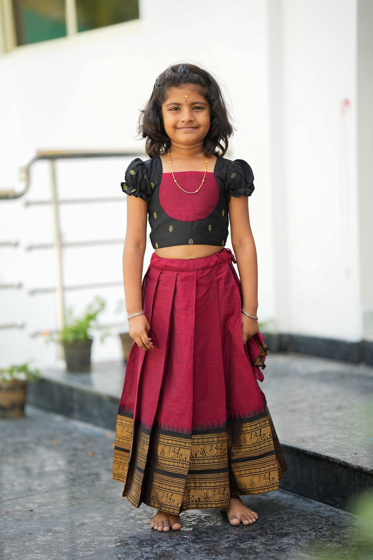 Front view of cotton skirt and top for girls with puff sleeves and box pleats