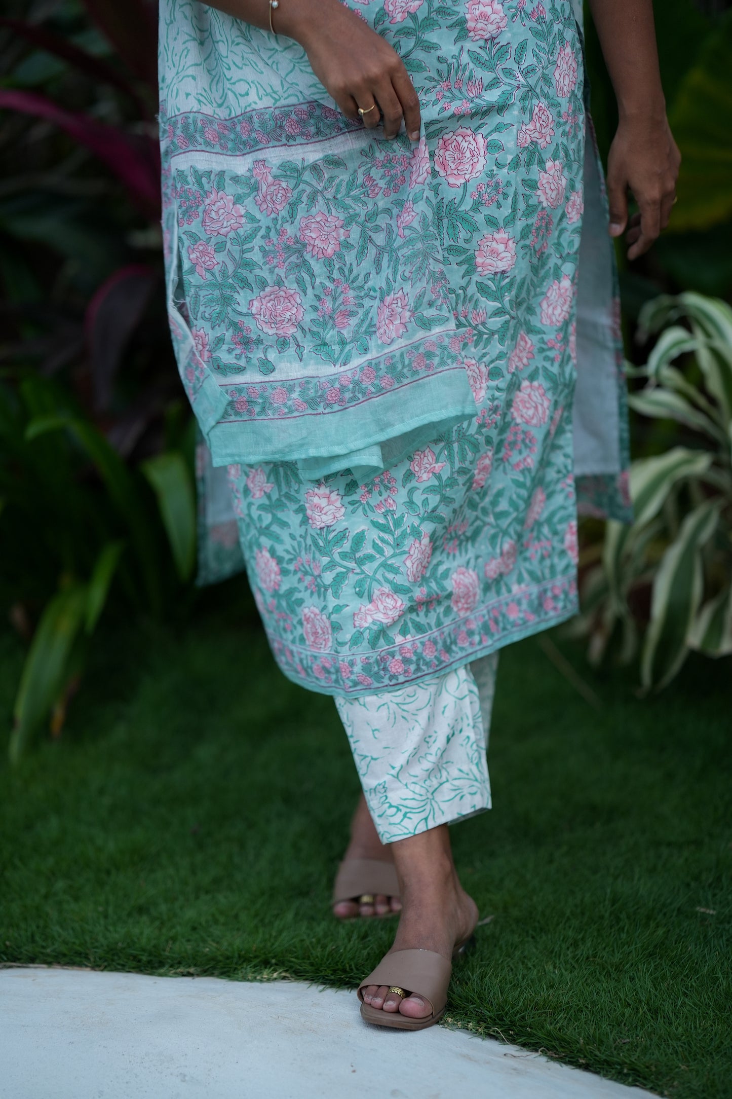 Detail of the floral print on the pastel mint green cotton kurti and pants