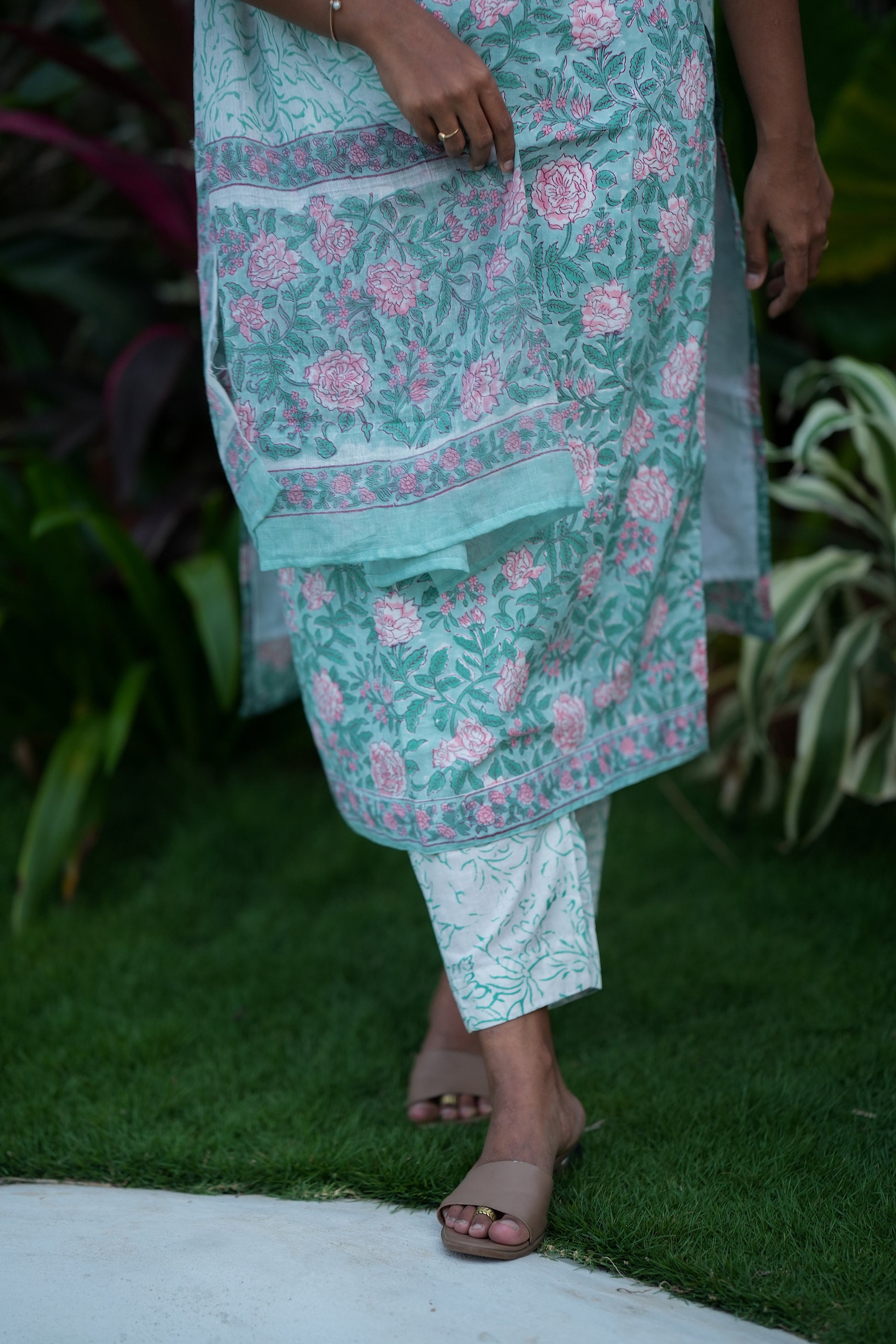 Detail of the floral print on the pastel mint green cotton kurti and pants