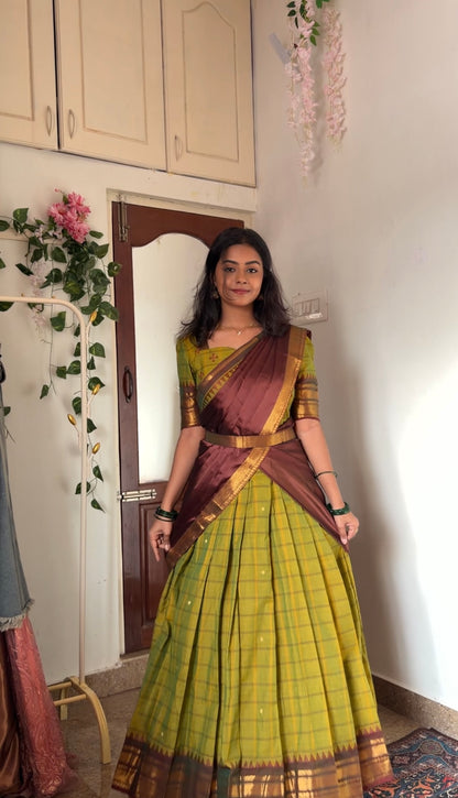 Tea green anarkali dress with maroon dupatta draped in a half-saree style, highlighting the multiwear option