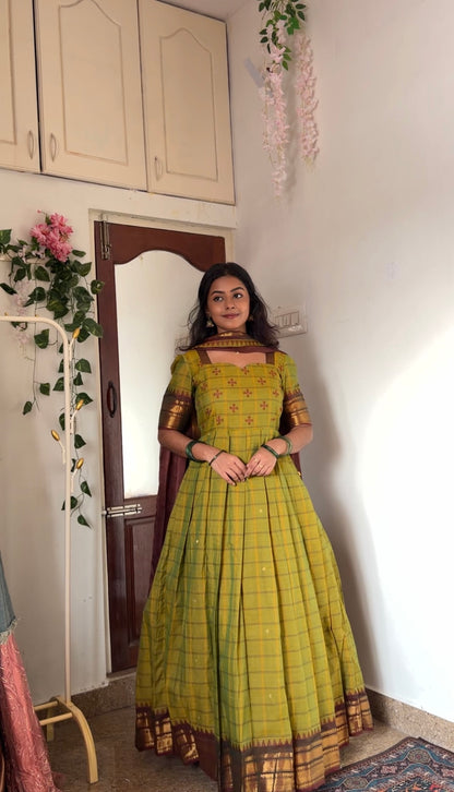 Tea green anarkali dress with a maroon dupatta draped over the shoulder, showcasing the ethnic set