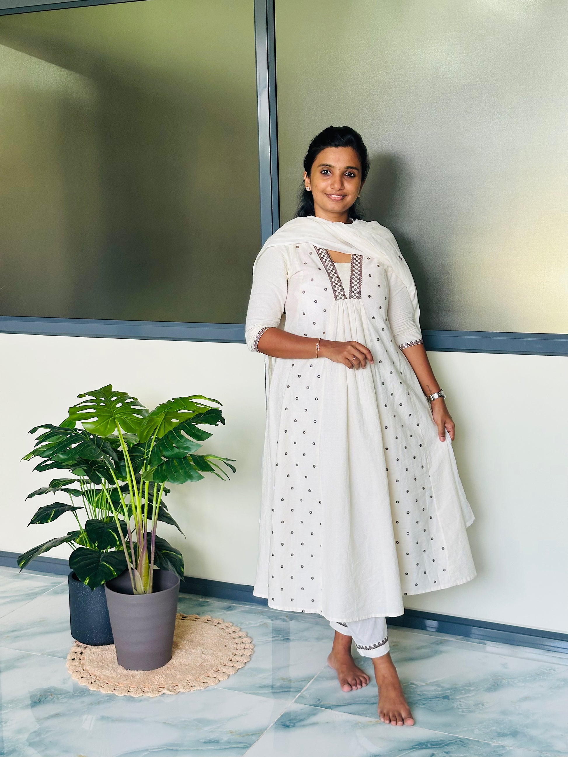 Anarkali style cotton kurti set paired with matching pants and dupatta