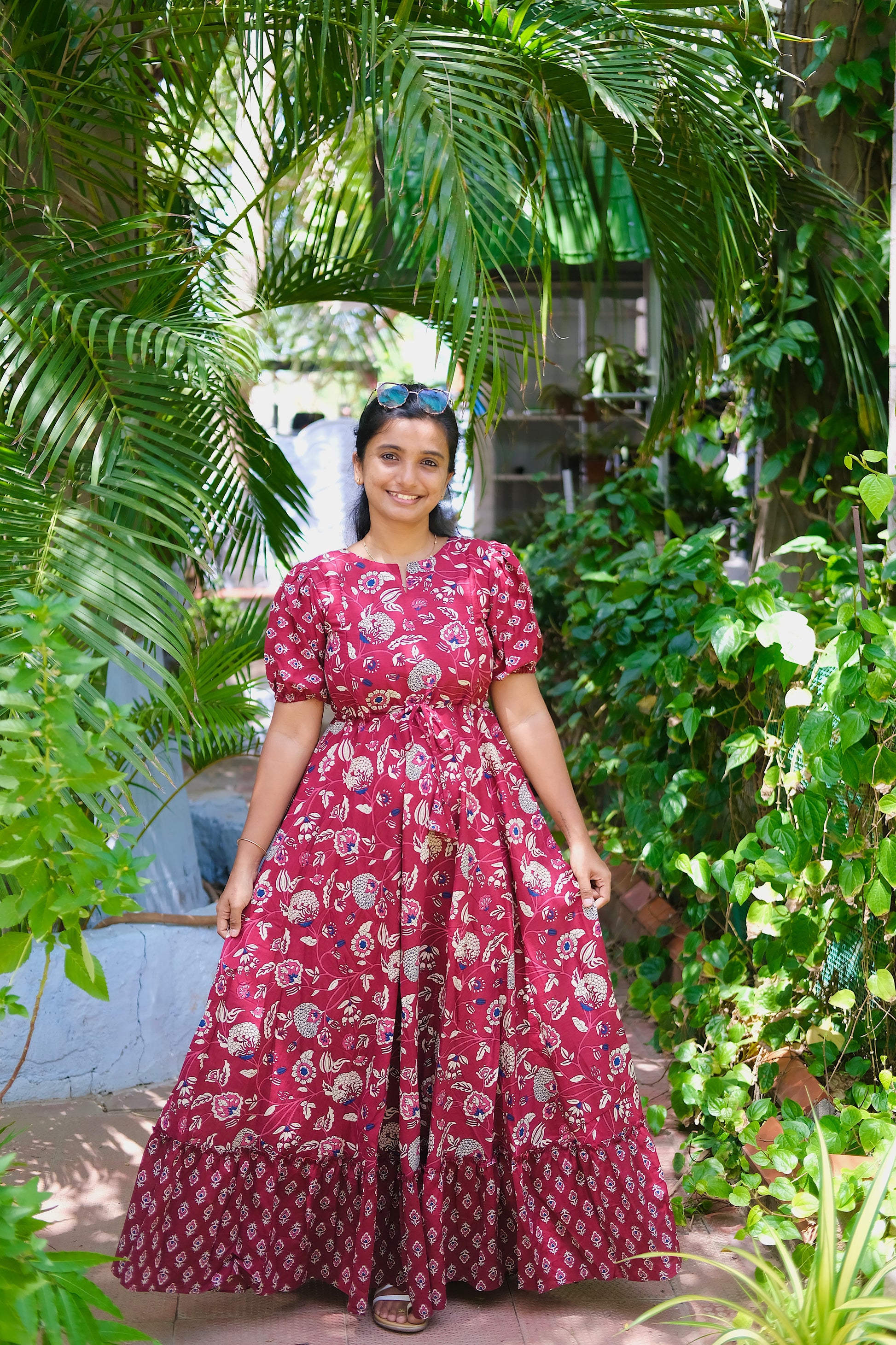 Nethra maroon printed cotton maxi dress for women featuring puff sleeves and a tiered skirt