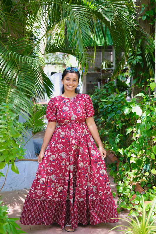 Nethra maroon printed cotton maxi dress for women featuring puff sleeves and a tiered skirt