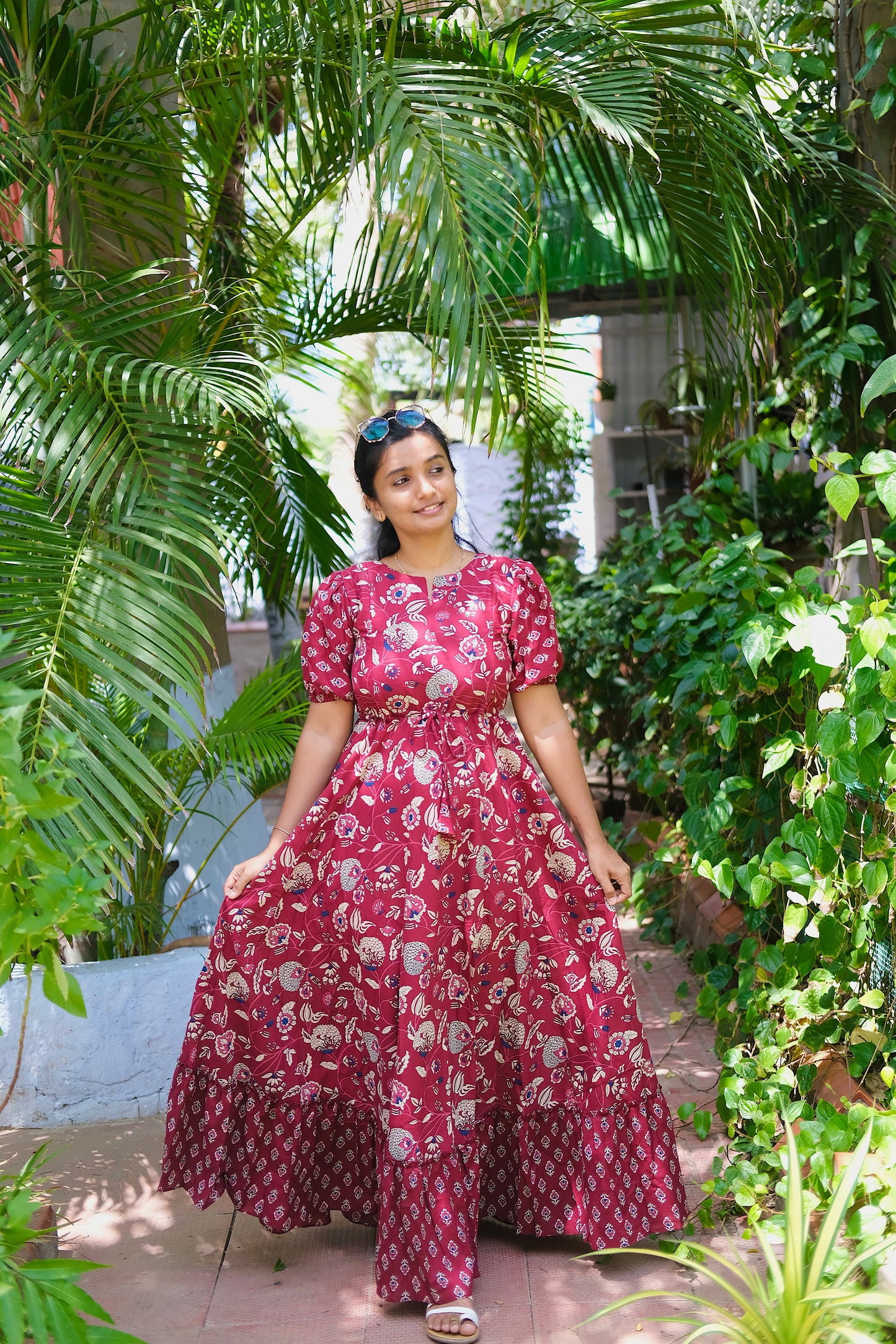Full-length view of the flared maroon cotton maxi dress with dual prints
