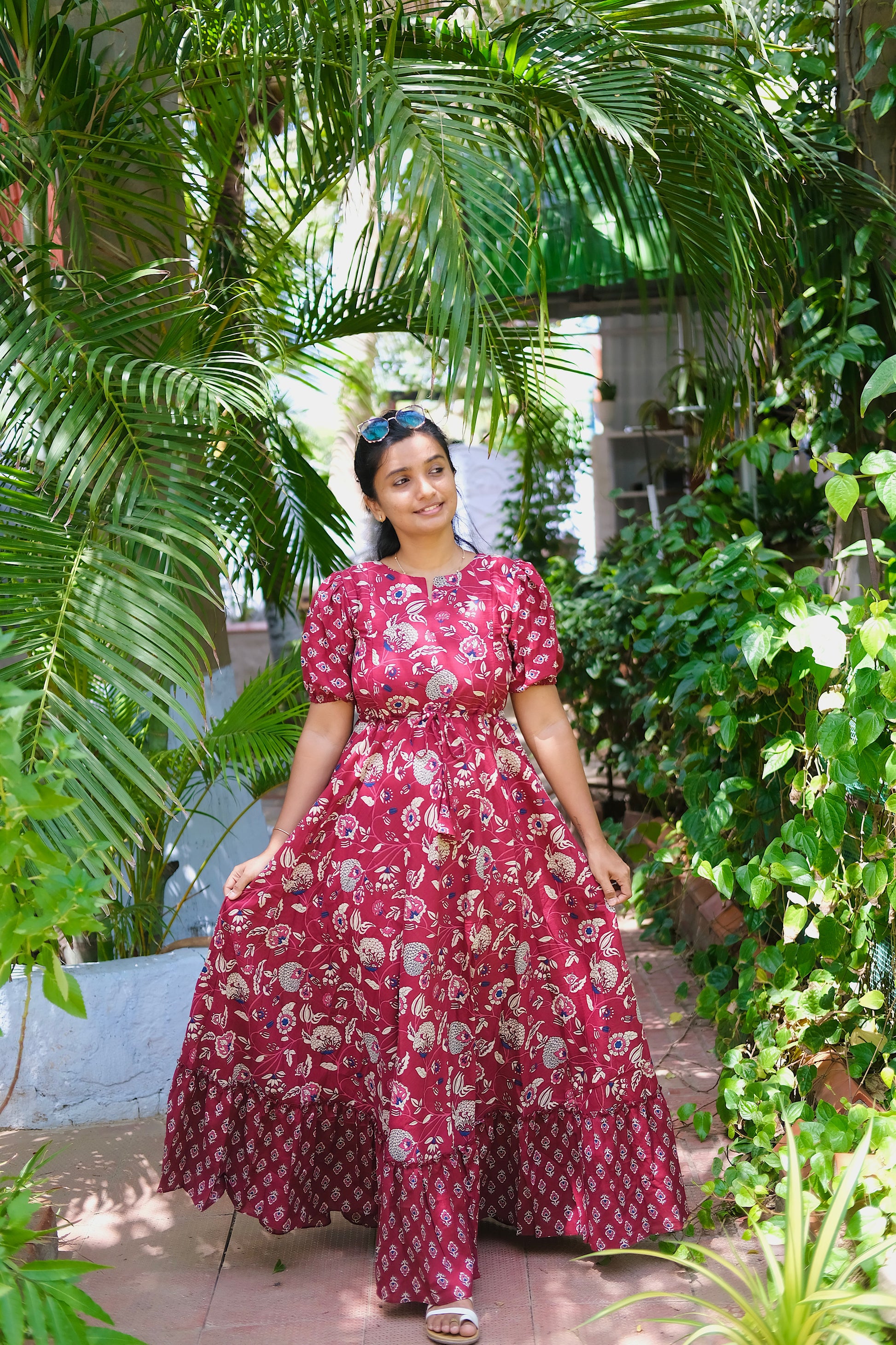 Full-length view of the flared maroon cotton maxi dress with dual prints