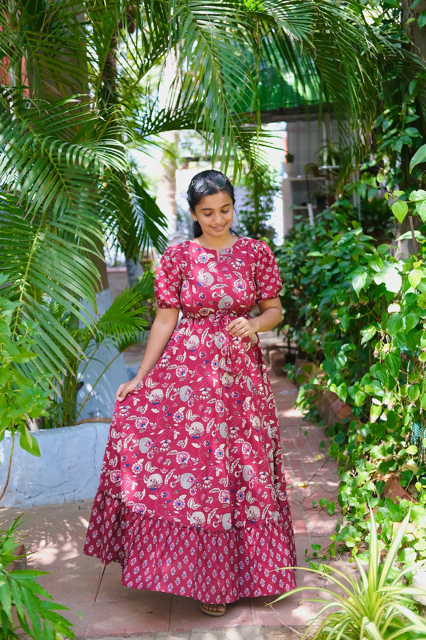 Front view of the printed cotton maxi dress showing the adjustable drawstring waist