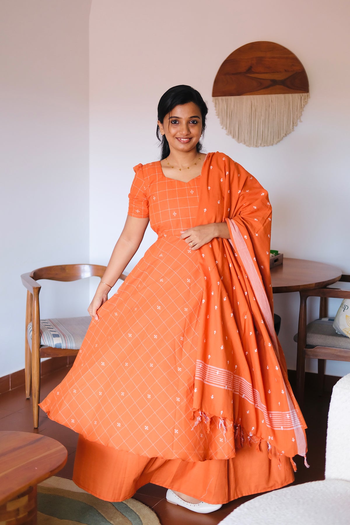 Full view of the rust orange cotton anarkali suit set featuring a layered maxi design and matching dupatta.