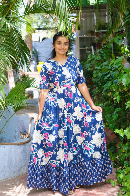 Deep blue cotton maxi dress with dual floral prints and a ruffled hem